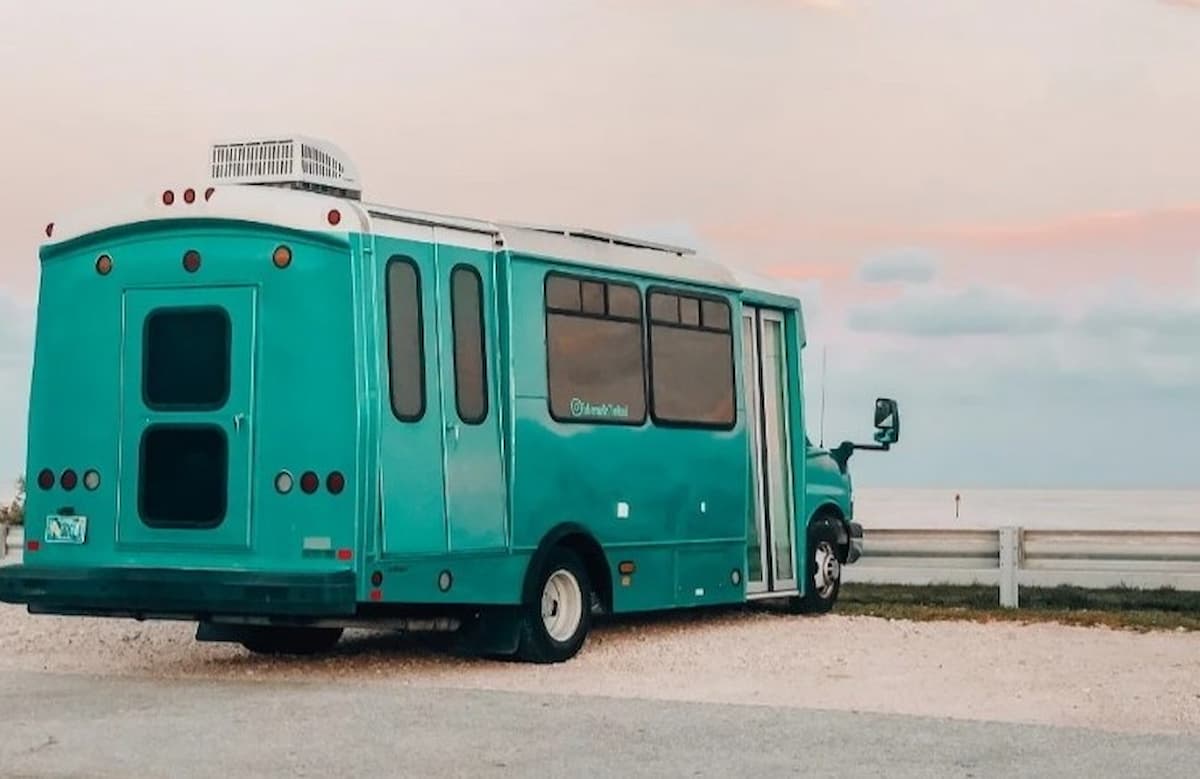 this chevy shuttle bus was turned into an off grid beach house on wheels 1
