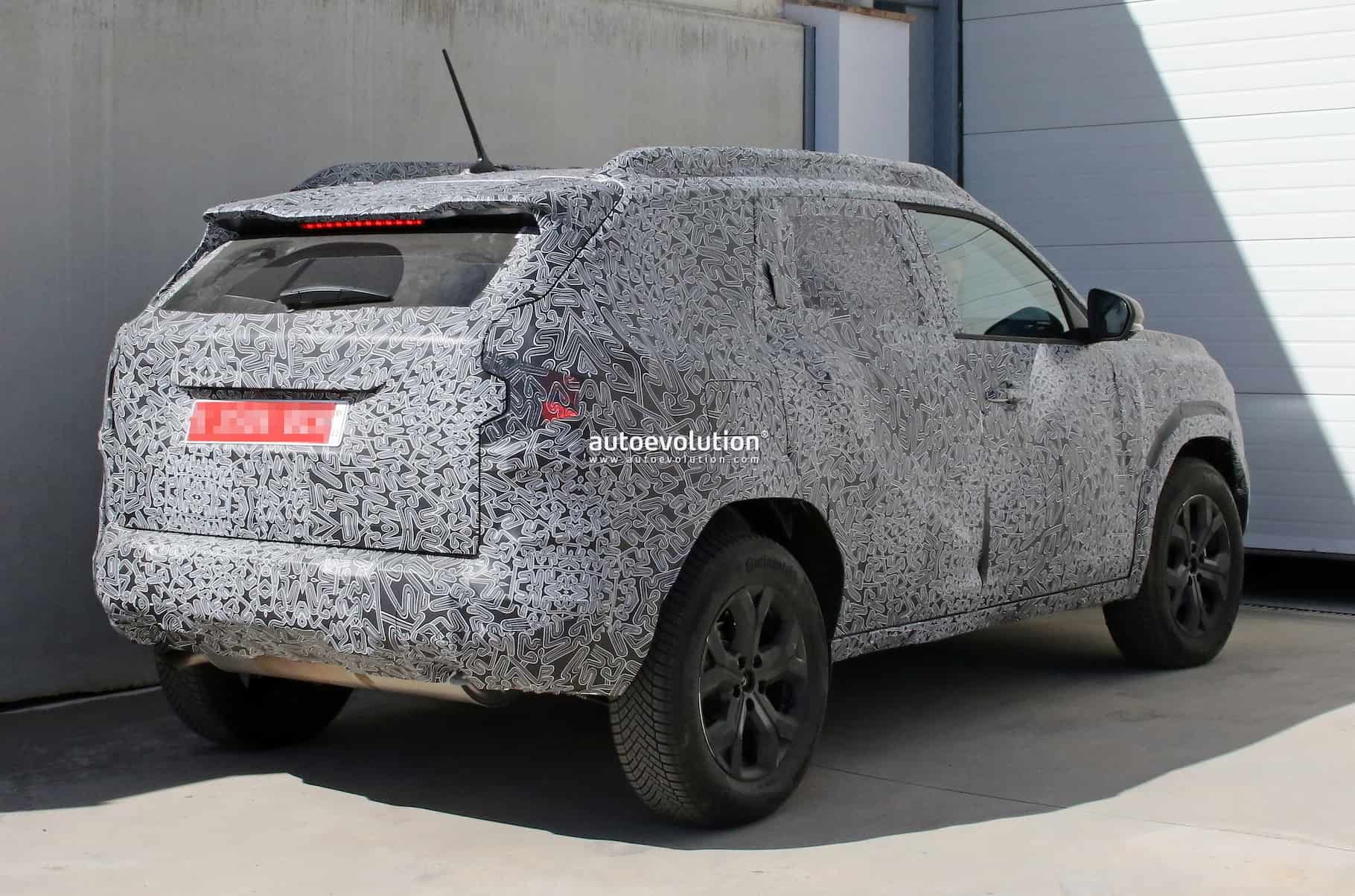 new dacia duster looks bigster in first spy shots 13