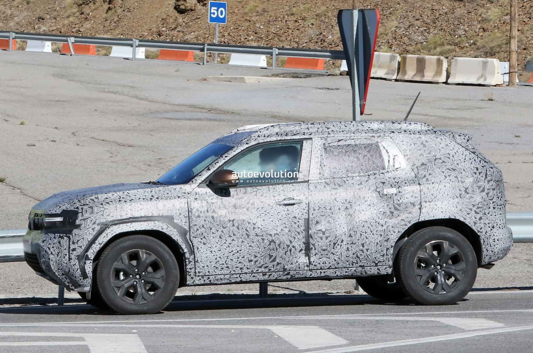 new dacia duster looks bigster in first spy shots 2