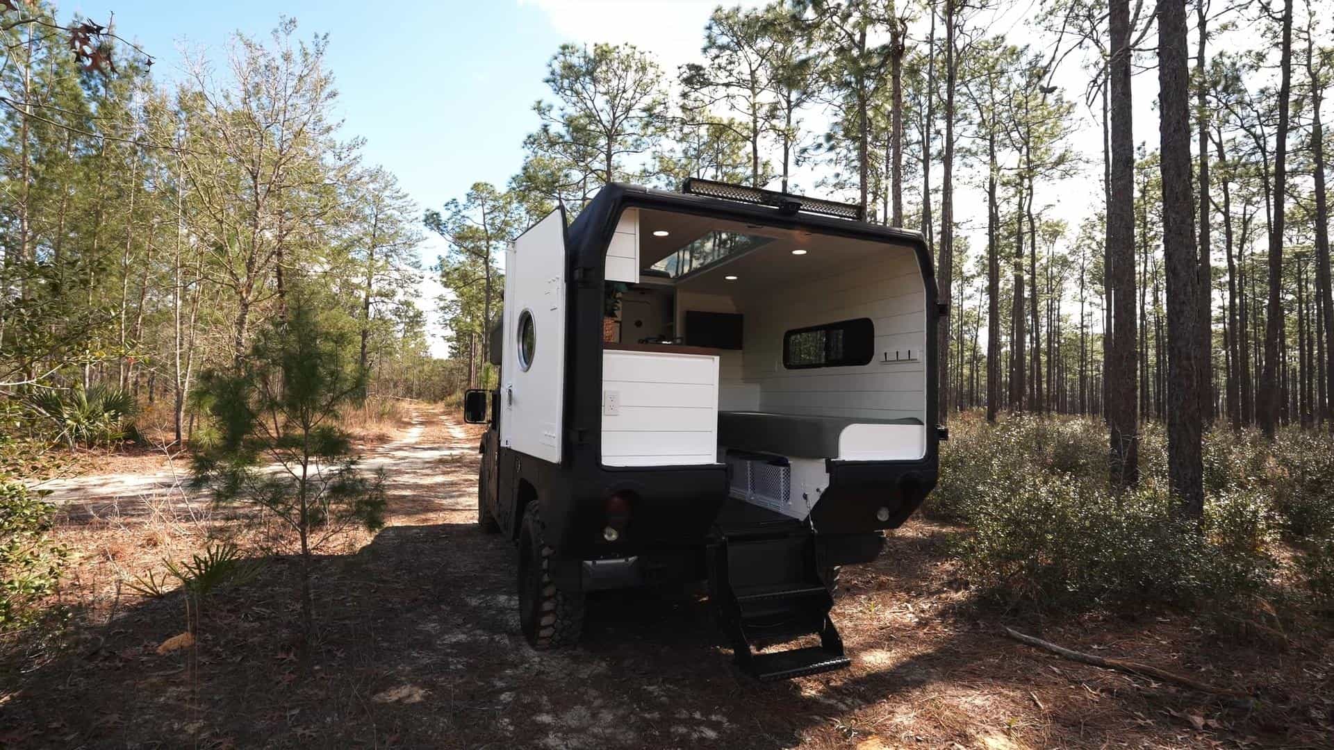 mean looking humvee hides a deluxe and modern tiny home interior it even has a bathroom 15 1