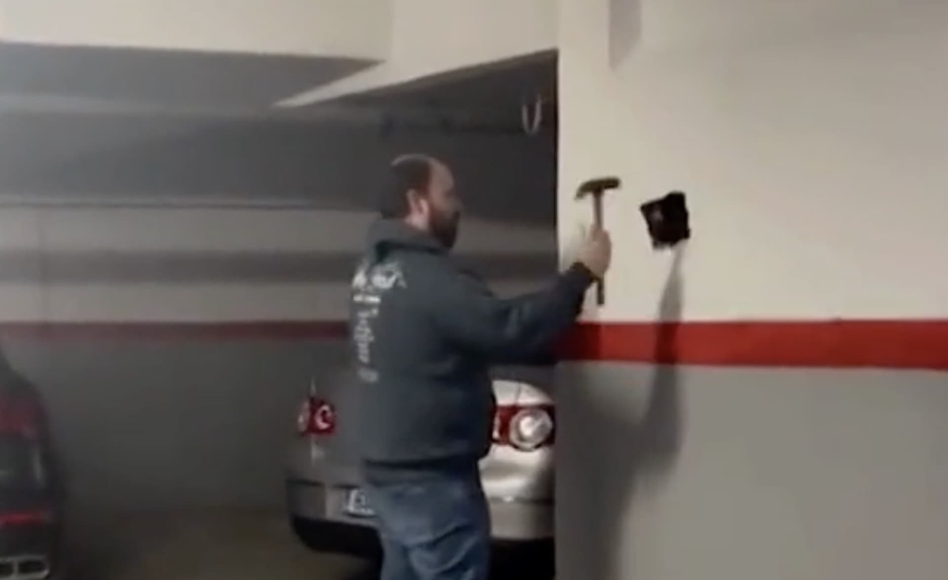 bmw owner has to hammer his car out of the wall built around it overnight 1